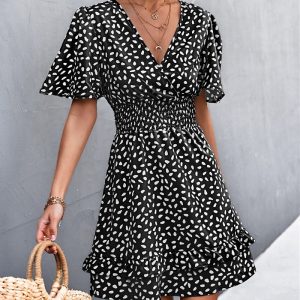 Robe bohème chic noire courte à motifs blancs